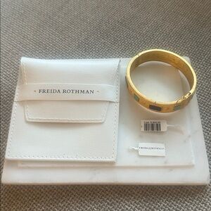 Freida Rothman Gold Bracelet with turquoise and blue accents.Original price 565$